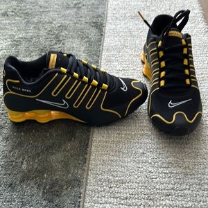 Nike Black Shox and Yellow Athletic Shoes with Bold Design